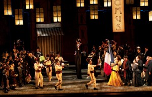 Two trumpeters lead the parade by Cafe Momus in Act II. Photo by Elise Bakketun.