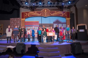 "It's a Merry Christmas Eve!" sung on a city sidewalk by townspeople and carolers